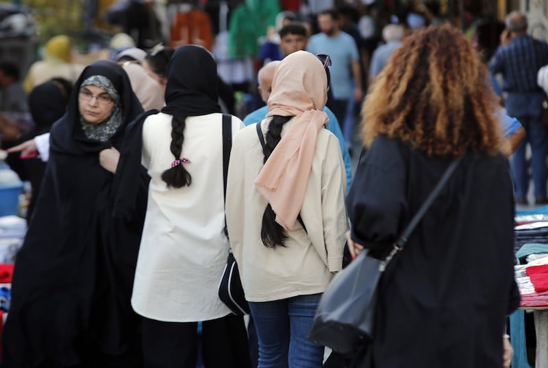 Iranian women, some without the mandatory headscarf, in Tehran. EPA