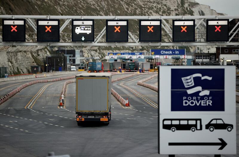 FILE PHOTO: A truck drives towards the entrance to the Port of Dover, following the end of the Brexit transition period, in Dover, Britain, January 15, 2021. REUTERS/John Sibley//File Photo