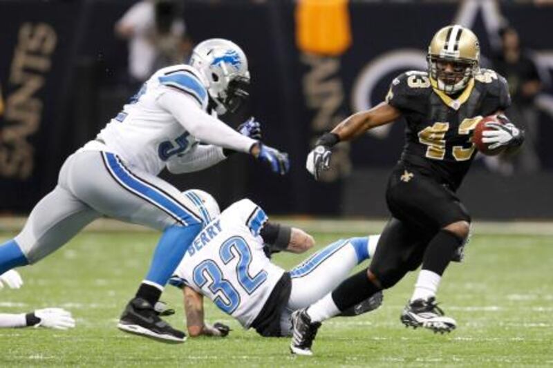 New Orleans Saints running back Darren Sproles (R) avoids Detroit Lions outside linebacker Justin Durant during the third quarter of their NFL NFC wildcard playoff football game in New Orleans, Louisiana, January 7, 2012. REUTERS/Jeff Haynes (UNITED STATES  - Tags: SPORT FOOTBALL) *** Local Caption ***  NEW133_NFL-PLAYOFFS_0108_11.JPG