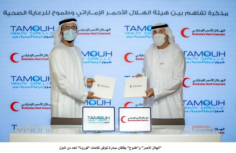 Abdullah Al Rashidi, chief executive of Tamouh Healthcare, left, and Dr Mohammed Al Falahi, secretary general of the ERC, at the launch of their joint Covid-19 vaccine initiative. WAM