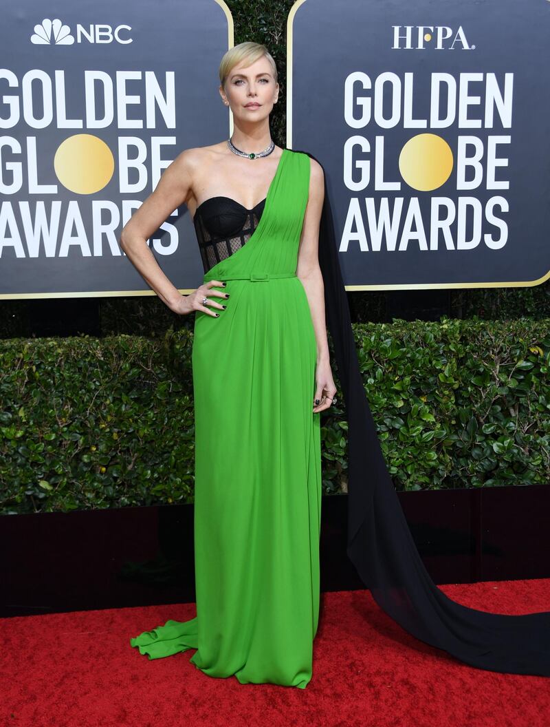 Charlize Theron went for a bright green and black gown for the 77th annual Golden Globe Awards. AFP