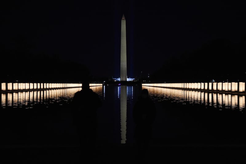 The Washington Monument is seen reflected after President-elect Joe Biden hosts a memorial to honor those who died from coronavirus disease (COVID-19), at the reflecting pool at the Lincoln Memorial, in Washington, U.S., January 19, 2021.    REUTERS/Callaghan O'Hare