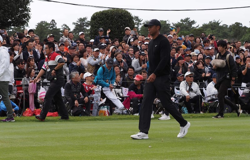 Tiger Woods after after putting his opening tee shot into the water. AFP