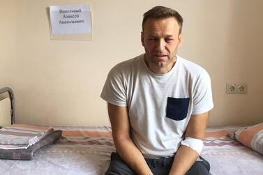 A handout image made available on the official website of Russia's opposition leader Alexei Navalny (Navalny.com) on July 29, 2019, shows Russia's jailed opposition leader Alexei Navalny sitting on a hospital bed in Moscow. AFP
