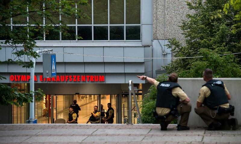 Police officers outside the OEZ shopping mall in Munich after at least three people were shot dead there on July 22, 2016.  Joerg Koch / Getty Images
