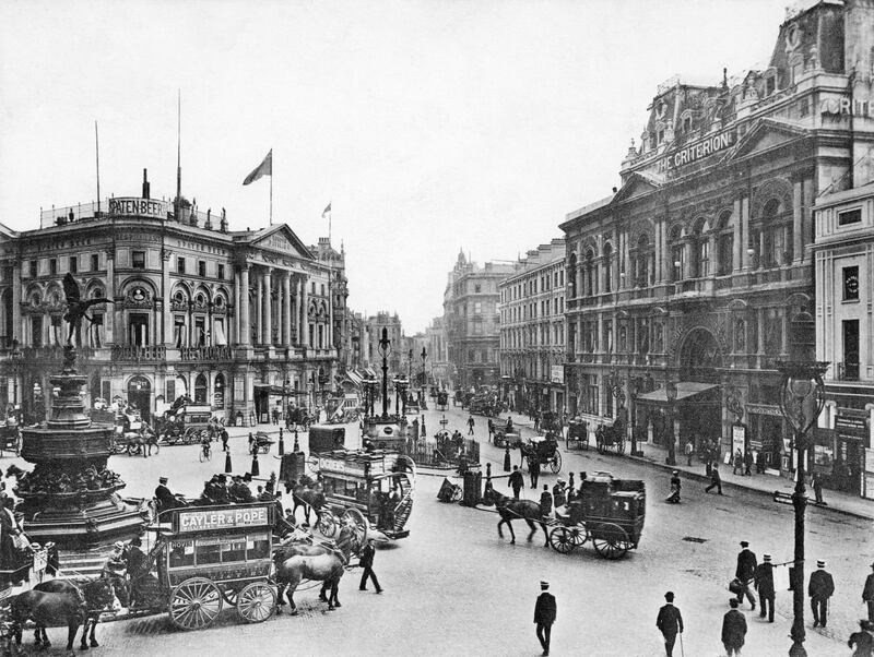 Horse-drawn carriages ply through Piccadilly Circus in London, before they were eventually replaced by motor cars in the early 1900s. Bettmann
