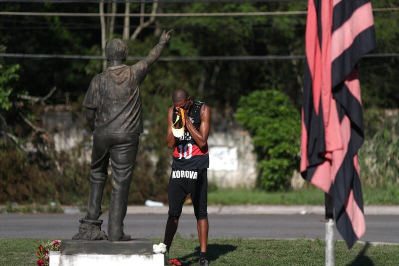 A Flamengo's soccer fan reacts in front of the club's training center, after a deadly fire, in Rio de Janeiro, Brazil. REUTERS