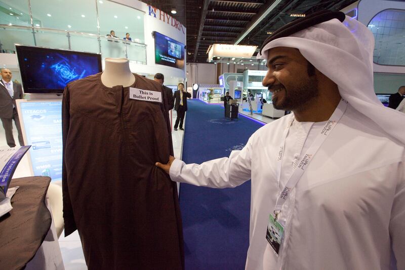 Dubai, United Arab Emirates, Feb 17, 2013 -  A man check a bulletproof kandoura at Miguel Caballero showroom during IDEX, International Defense Exhibition Conference at Abu Dhabi Exhibition Centre, ADNEC.   ( Jaime Puebla / The National Newspaper ) To hold with john henzell story idex ancillary stalls *** Local Caption ***  JP0217-IDEX18.jpg
