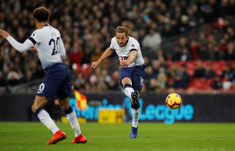 Harry Kane shoots to score Tottenham;s second goal against Chelsea. Reuters