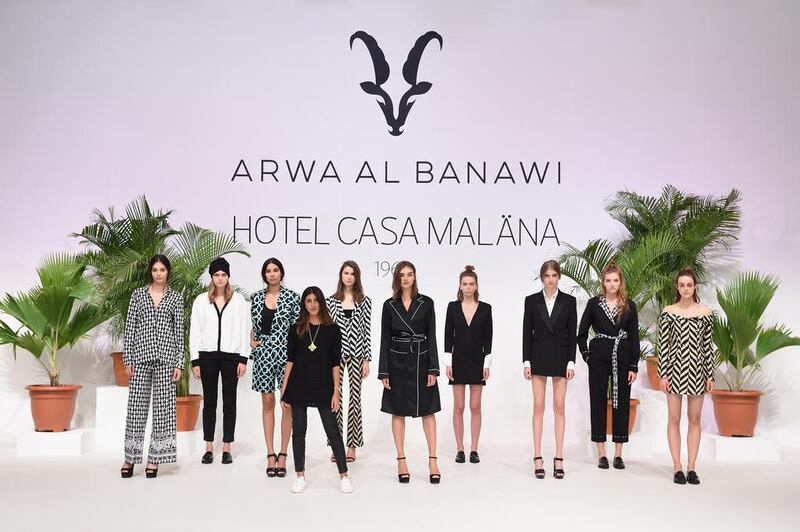 Saudi-born designer Arwa Al Banawi, front, with models. Stuart C Wilson / Getty Images