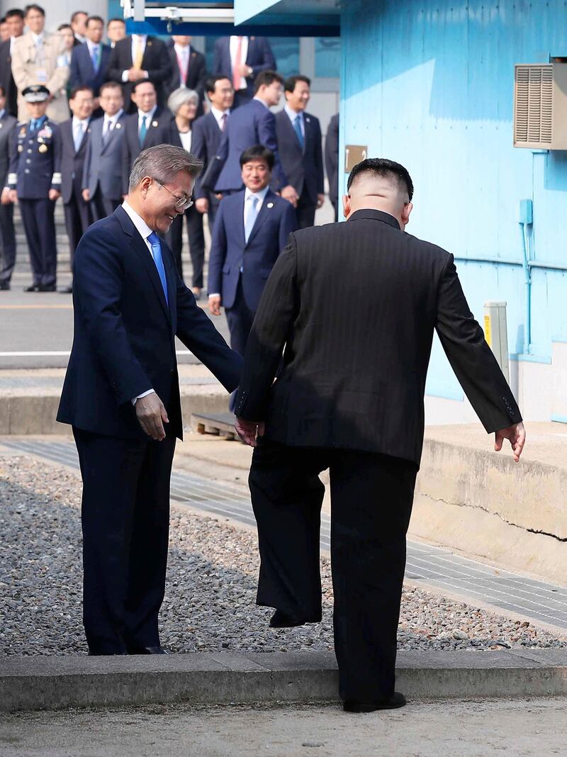 North Korean leader Kim Jong-un crosses the military demarcation line to meet with South Korean president Moon Jae-in. Korea Summit Press Pool via AP