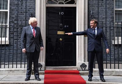 French President Emmanuel Macron alongside Britain's Prime Minister Boris Johnson during a visit to Downing Street in central London in June 2020. AFP