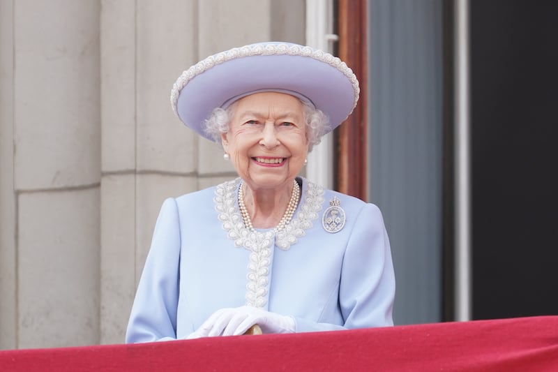 Queen Elizabeth II watches from the balcony during Trooping the Colour at Horse Guards Parade, central London, on day one of the platinum jubilee weekend celebrations. PA