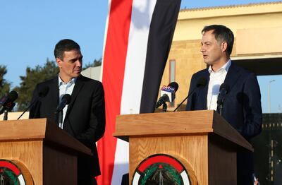Spanish Prime Minister Pedro Sanchez (L) and Belgium's Prime Minister Alexander De Croo (R) speak at a press conference at the Rafah border crossing. EPA