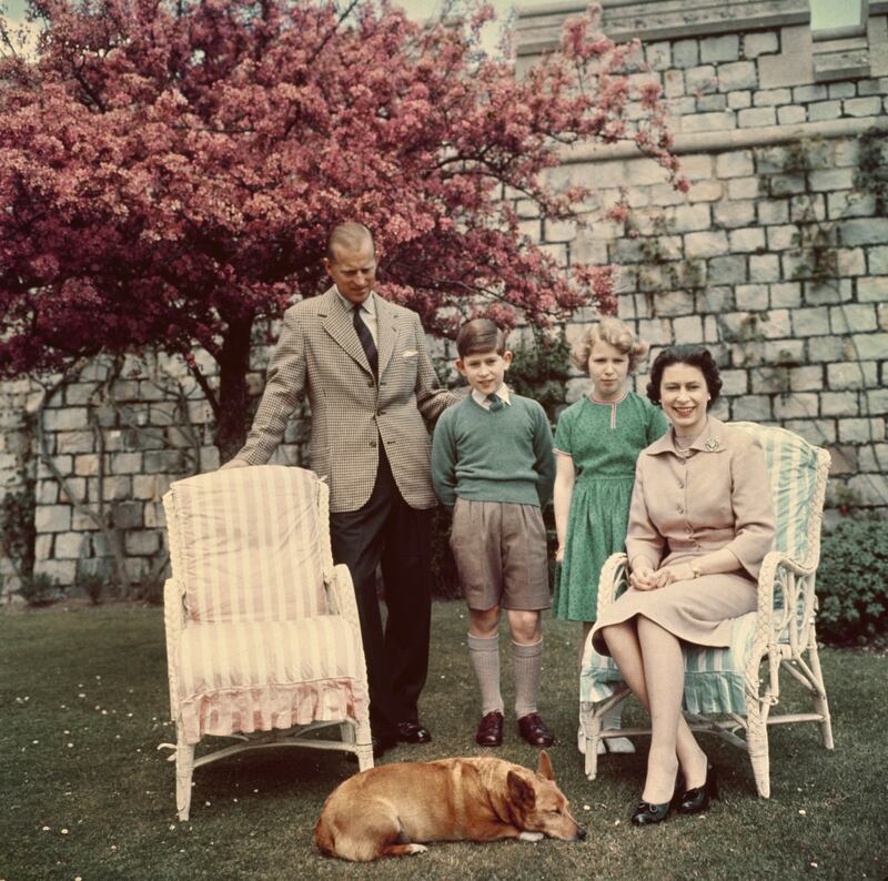 Prince Philip, Prince Charles, Princess Anne and Queen Elizabeth in the gardens of Windsor Castle in 1959. 