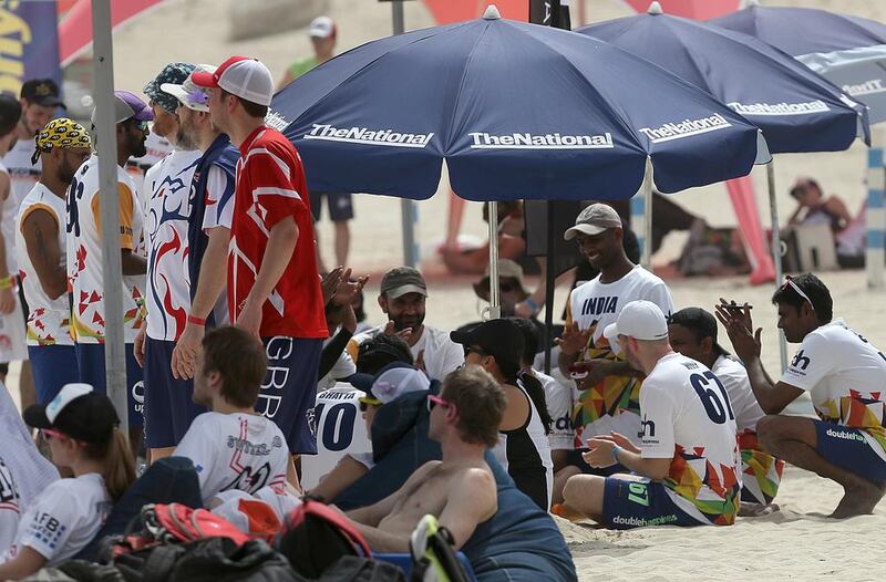 Athletes relax in the shade during the 2015 World Championships of Beach Ultimate (WCBU) at the JBR beach in Dubai. Satish Kumar / The National