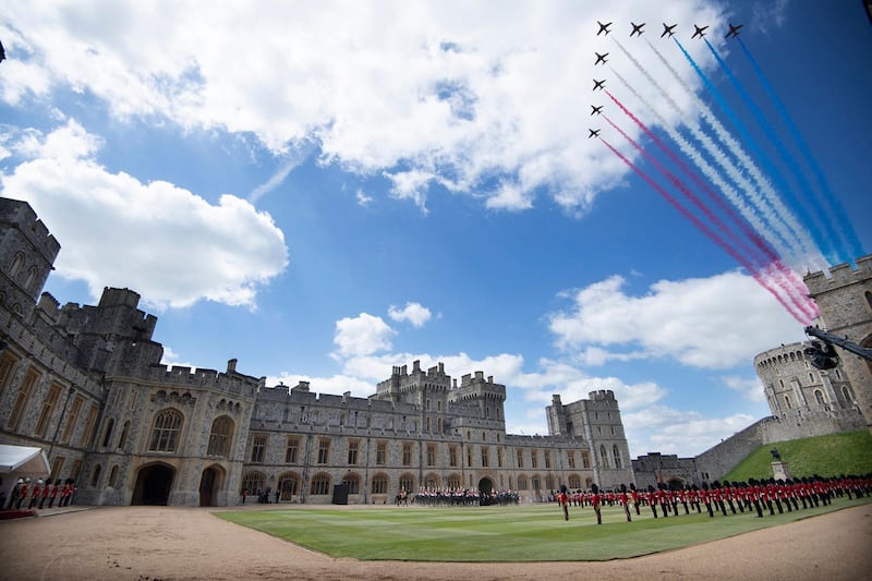 The Red Arrows conduct a flypast for Queen Elizabeth II's official birthday celebrations at Windsor Castle. AFP
