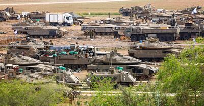 Israeli armour including Merkava tanks, form up outside Gaza. EPA