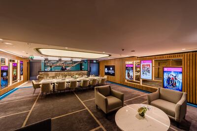 The cinema also comes with a bar, lounge area and dining table. Courtesy Majid Al Futtaim