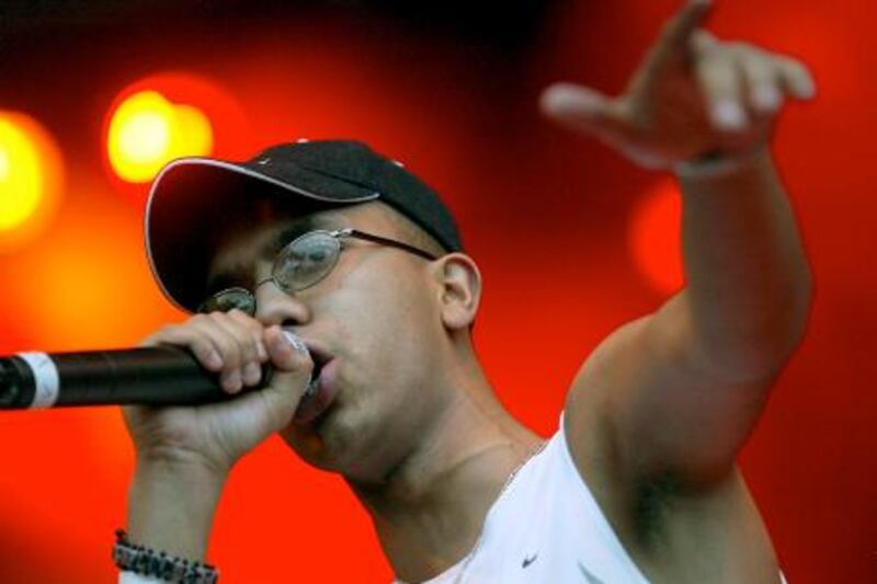 Spex, singer of British band "Asian Dub Foundation", performs during a concert at the Open Air in Emmen, Switzerland, Friday, Aug. 2, 2002. (AP Photo/Keystone, Urs Flueeler)