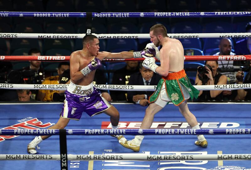 Gabriel Flores Jr (left) and Matt Conway in the light weight bout at the MGM Grand, Las Vegas. PA Wire.