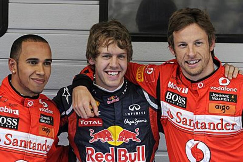 Sebastian Vettel, centre, was more subdued in celebrating securing pole for the third time in three races.