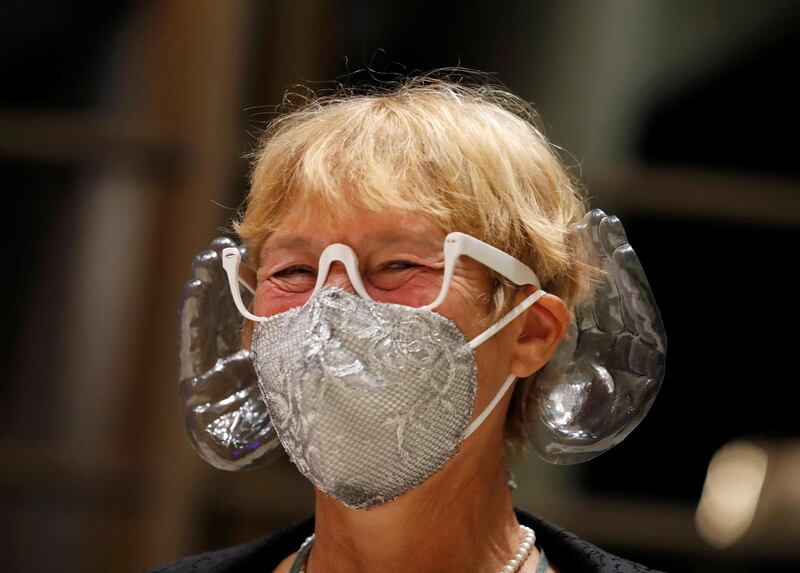 A woman wears orchestra conductor Ivan Fischer's acoustic mask at the Mupa Budapest in Budapest, Hungary, September 11, 2020. Picture taken September 11, 2020. REUTERS/Bernadett Szabo