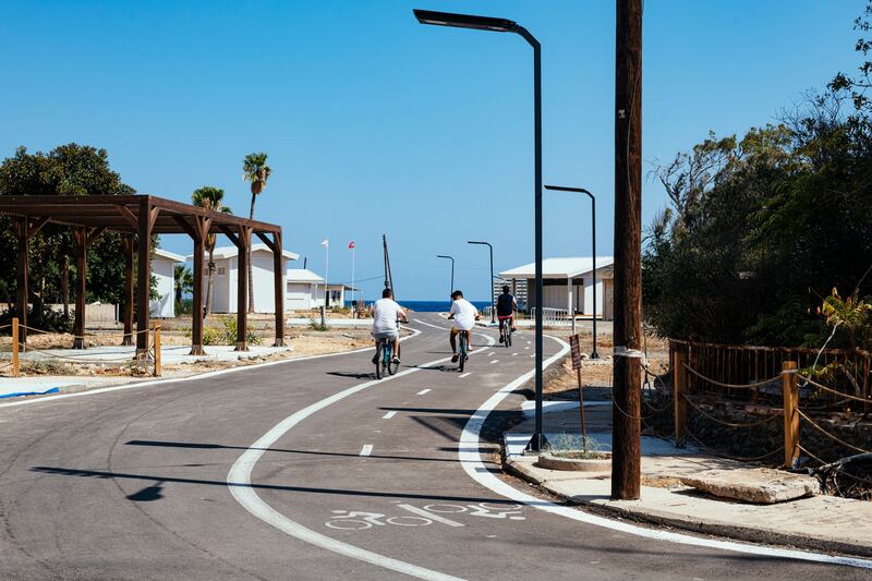 Cyclists use a recently repaired road