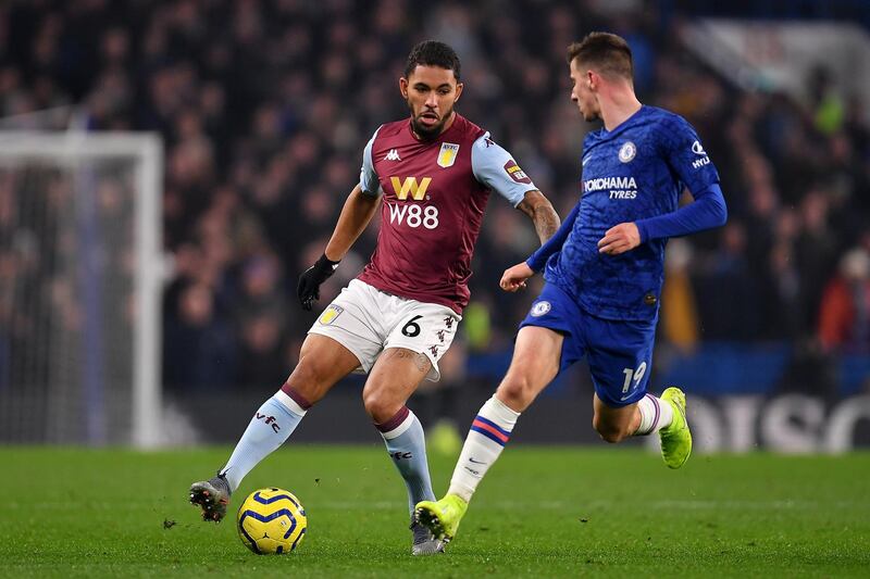 Aston Villa's Douglas Luiz  takes on Mason Mount. Getty Images