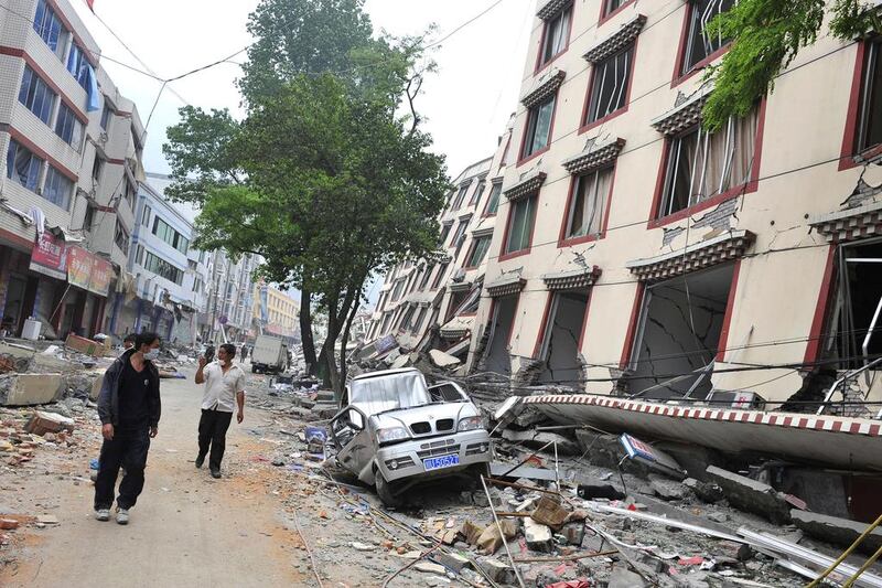 Estimates put the direct damage of the May 12, 2008, Sichuan earthquake in China at $29 billion. Above, survivors walk through the rubble at Yingxiu town in Wenchuan. Teh Eng Koon / AFP