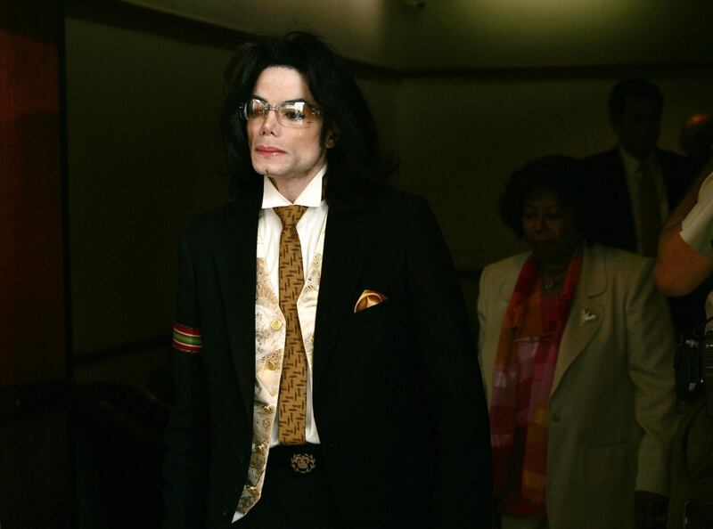 (FILES) In this file photo taken on June 3, 2005 Michael Jackson leaves the courtroom on a break at the Santa Barbara County Courthouse for the second day of closing arguments in his child molestation trial in Santa Maria, California.  Michael Jackson's family on January 28, 2019 lashed out against a new documentary that has renewed focus on allegations the singer sexually abused young boys, calling the subsequent social media outrage a "public lynching." Dubbing the late King of Pop an "easy target," the Jackson family said they were "furious" over the bombshell "Leaving Neverland" expose that premiered Friday at the Sundance Film Festival. / AFP / POOL / KEVORK DJANSEZIAN
