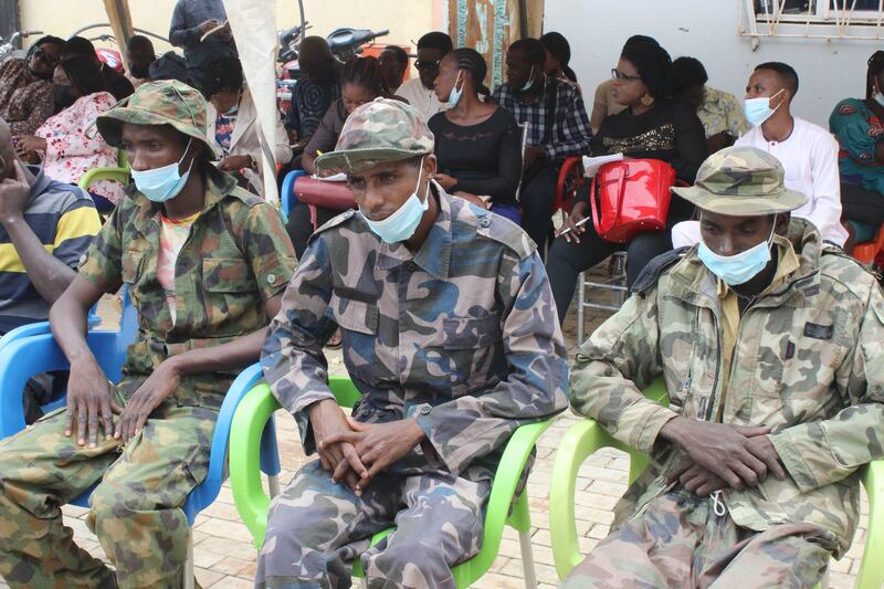 Three men identified as kidnappers of The Bethel Baptist High School pupils are shown to the media in Abuja, Nigeria, on Thursday. AP