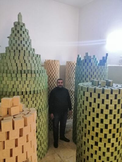 Amer Abu Al Samen at his soap workshop in Amman. He caters for a large segment of the Jordanian population who cannot afford high-end soap. The National