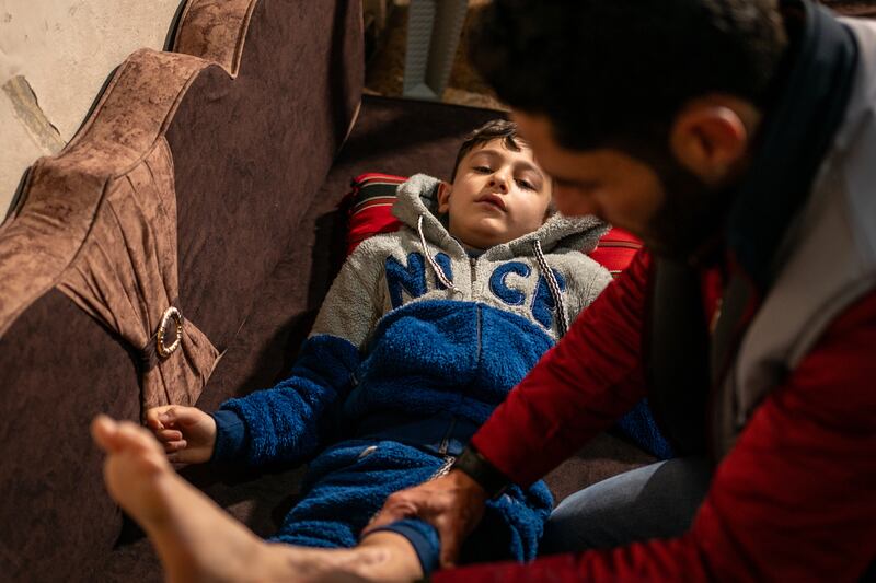 Mr Bardoush also helps Mustafa and Alaa's brother Muhammad with his exercises. The earthquake killed about 60,000 people in Syria and Turkey and left 130,000 injured 