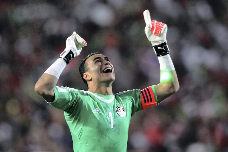 Egypt's Essam El-Hadary celebrates wining against Congo's team during their World Cup 2018 Africa qualifying match between Egypt and Congo at the Borg el-Arab stadium in Alexandria on October 8, 2017.
Liverpool striker Mohamed Salah converted a stoppage-time penalty to give Egypt a dramatic 2-1 win over Congo Brazzaville Sunday and a place at the 2018 World Cup in Russia. / AFP PHOTO / TAREK ABDEL HAMID