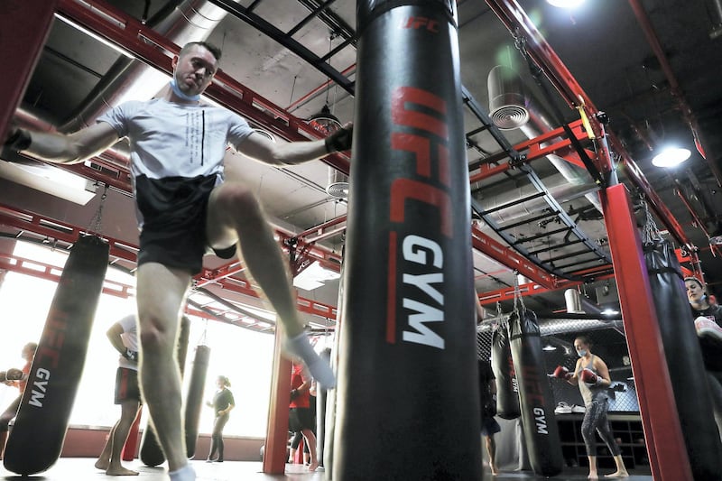 DUBAI, UNITED ARAB EMIRATES , August 10 – 2020 :- Participants during the Kick boxing session at the UFC Gym in Murjan 6 in Jumeirah Beach Residence in Dubai. They are taking part in the 90 minutes MMA Mash up. (Pawan Singh / The National) For News/Online/Instagram. Story by Nick Webster
