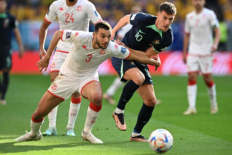 Tunisia's defender Montassar Talbi and Australia's midfielder Ajdin Hrustic fight for the ball. AFP