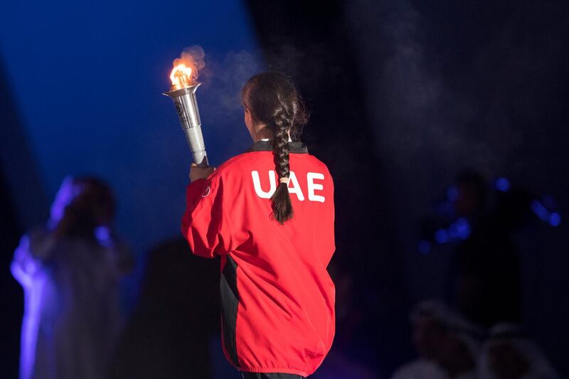 ABU DHABI, UNITED ARAB EMIRATES - March 17, 2018: UAE athlete Mariam Al Zaabi, carries the Flame of Hope during the opening ceremony of the Special Olympics IX MENA Games Abu Dhabi 2018, at the Abu Dhabi National Exhibition Centre (ADNEC).
( Ryan Carter for the Crown Prince Court - Abu Dhabi )
