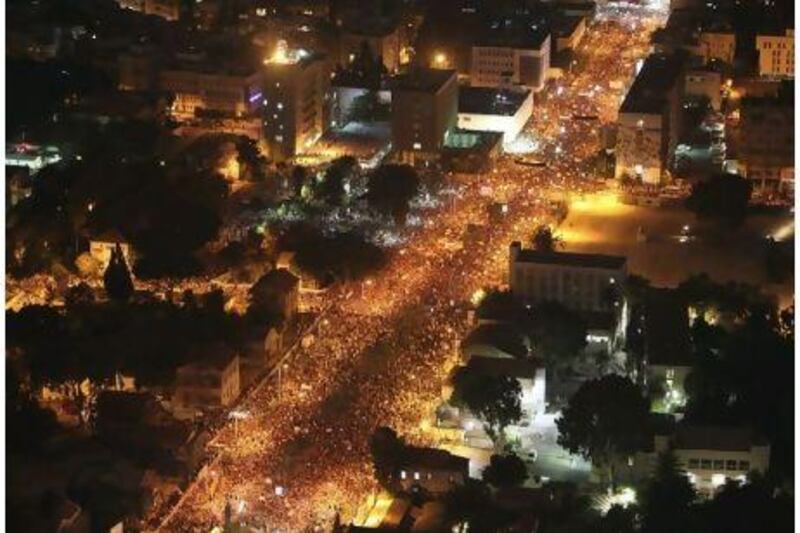 More than 250,000 Israelis turned out for a march in Tel Aviv on Saturday to protest against the rising cost of living. Similar protests on a smaller scale have been staged across the country since mid-July. Oded Balilty / AP Photo