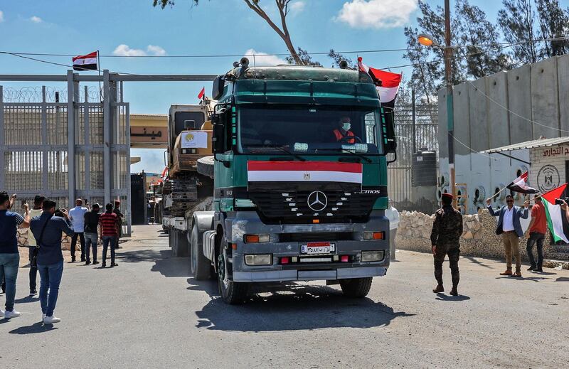 An excavator provided by Egypt arrives on a trailer at Rafah. The convoy also brought engineers. AFP