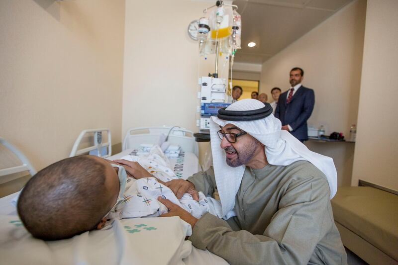 SEOUL, REPUBLIC OF KOREA (SOUTH KOREA) - February 27, 2014:  HH General Sheikh Mohamed bin Zayed Al Nahyan Crown Prince of Abu Dhabi Deputy Supreme Commander of the UAE Armed Forces (C)
greets a young Emirati patient receiving treatment at Seoul Saint Mary's Hospital in the Republic of Korea. Seen with HH Sheikh Hamed bin Zayed Al Nahyan Chairman of Crown Prince Court - Abu Dhabi and Executive Council Member  (Back R).
( Mohamed Al Hammadi / Crown Prince Court - Abu Dhabi )
---