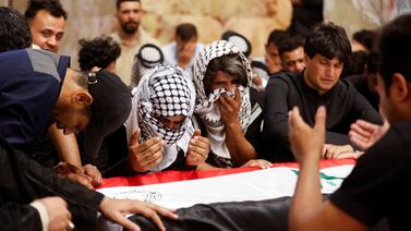 Mourners gather at the coffin of an Iraqi soldier killed in an attack in Najaf on Tuesday. Reuters