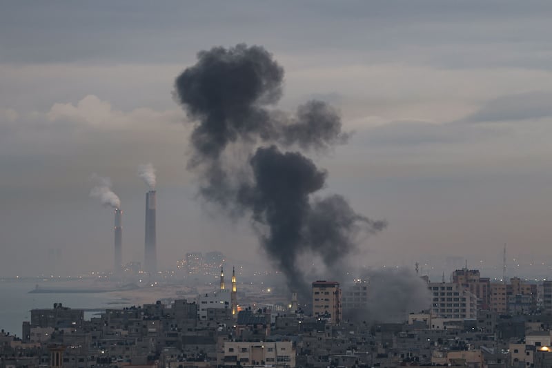 Smoke rises above buildings in Gaza city as Israel launches air strikes on the Palestinian enclave. AFP