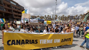 Protesters march in Las Palmas de Gran Canaria, Canary Islands, on Saturday. The banner reads 'The Canary Islands have a limit'. EPA