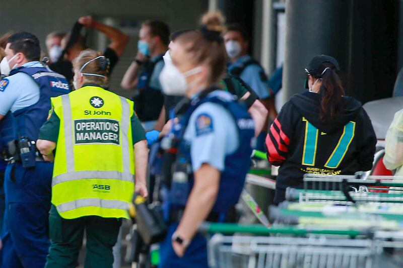 New Zealand authorities say they shot and killed a violent extremist after he entered a supermarket and stabbed and injured six shoppers. New Zealand Herald via AP