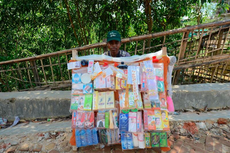 A Rohingya refugee selling cosmetic items waits for customers in Kutupalong refugee camp. AFP