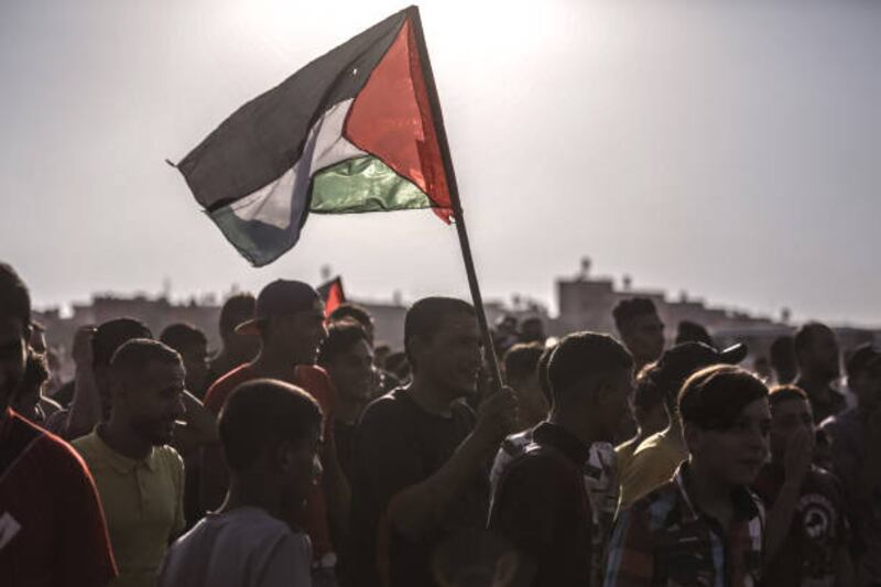 Palestinian protesters gather near the fence of the Gaza Strip border with Israel during a demonstration. Getty Images