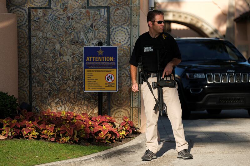 A Secret Service agent guards Mr Trump's Mar-a-Lago resort and home in Florida. Reuters