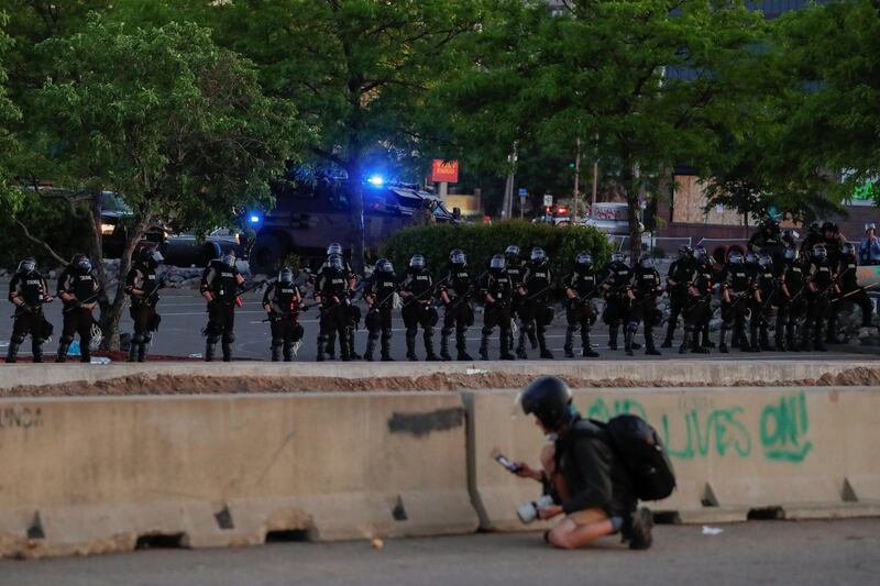 Security forces stand guard during a protest in Minneapolis, Minnesota, US. Reuters