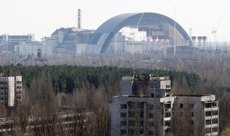 A protective shelter being mounted over the remains of the Chernobyl nuclear power plant in Ukraine. The explosion there in 1986 led to major nuclear fallout over a wide area and the site still remains radioactive. Yet the accident caused comparatively few casualties. Oleksandr Lepetuha / EPA

